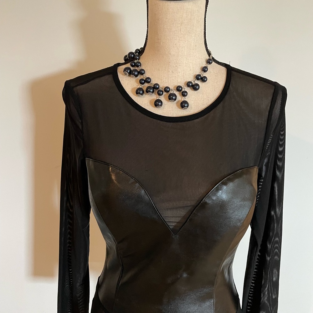 Black see through and leather like material long sleeve shirt. Size small